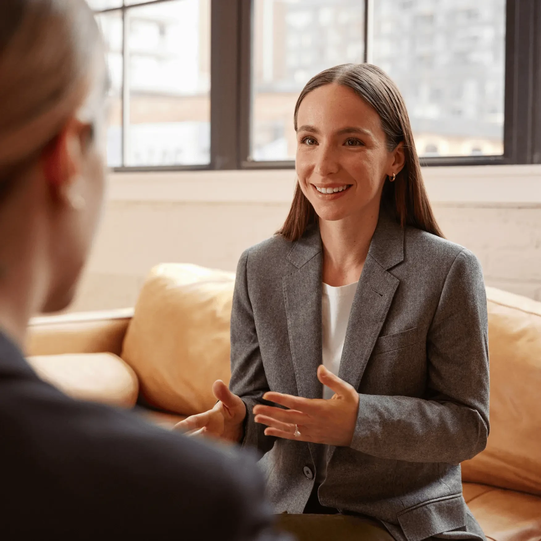 Photograph of one of Wealthsimple advisors, Zoe, speaking to a client.