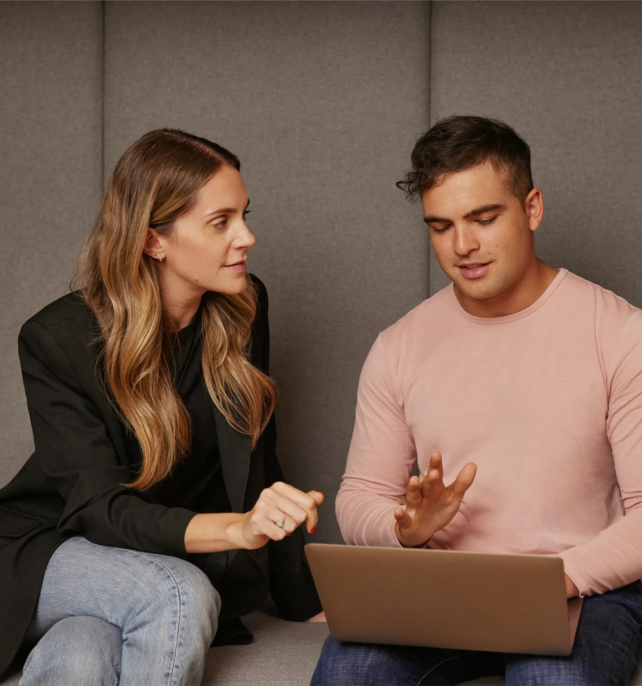Two Wealthsimple employees having a discussion in an office setting
