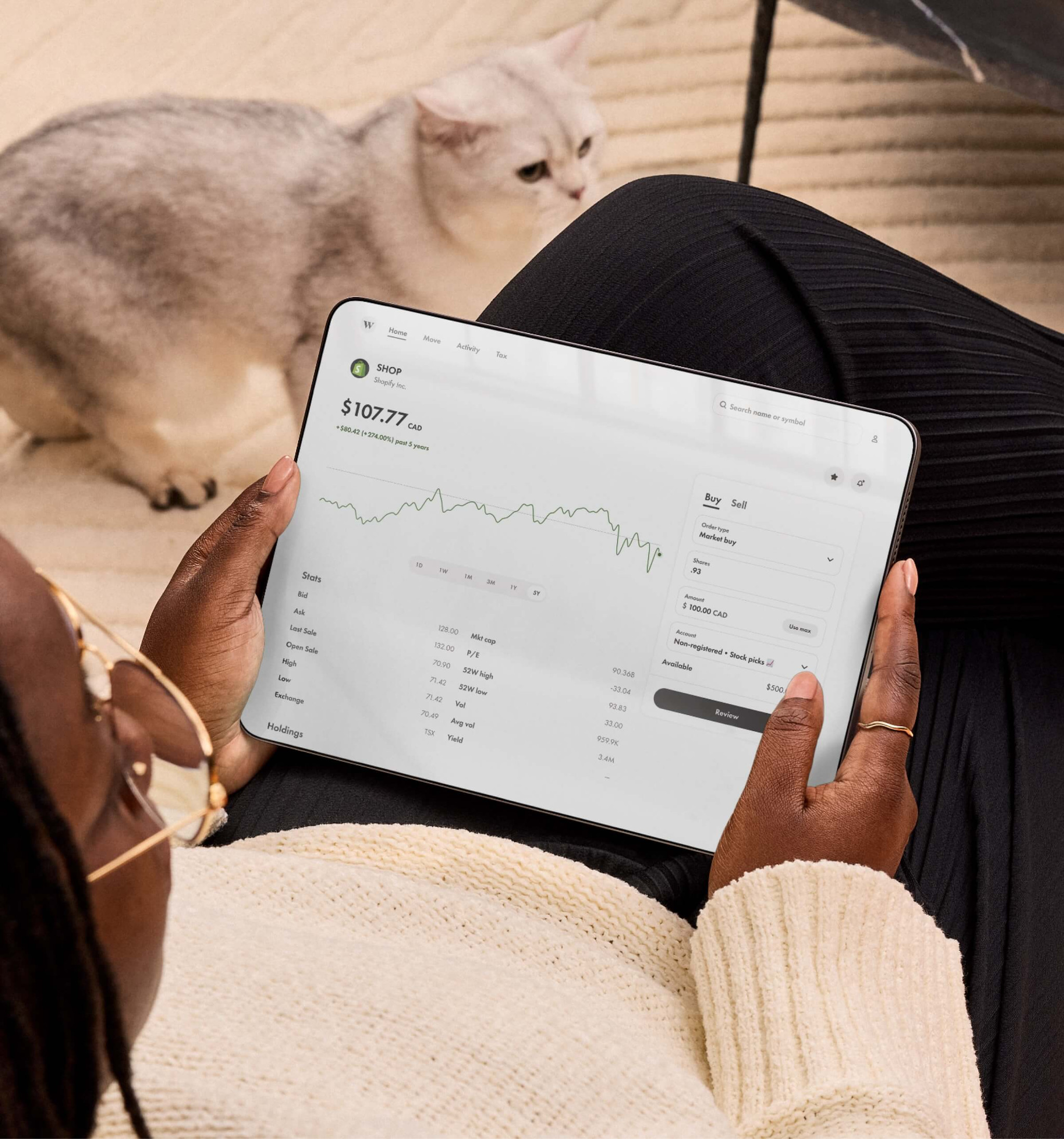 A client using the Wealthsimple app on a tablet