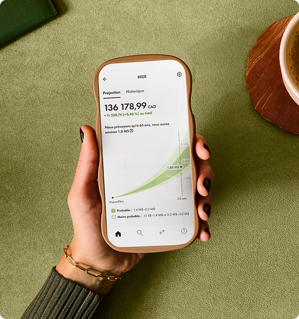 Une photo d'une main tenant un cellulaire qui montre un compte REER sur l'appli Wealthsimple.