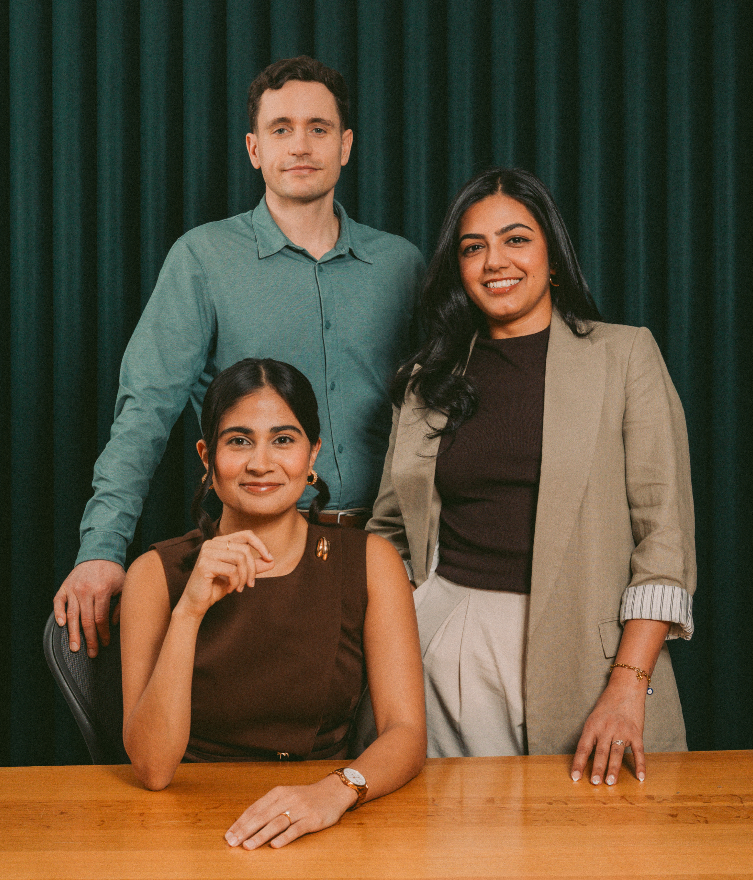 Three Wealthsimple Wealth Management advisors standing together.