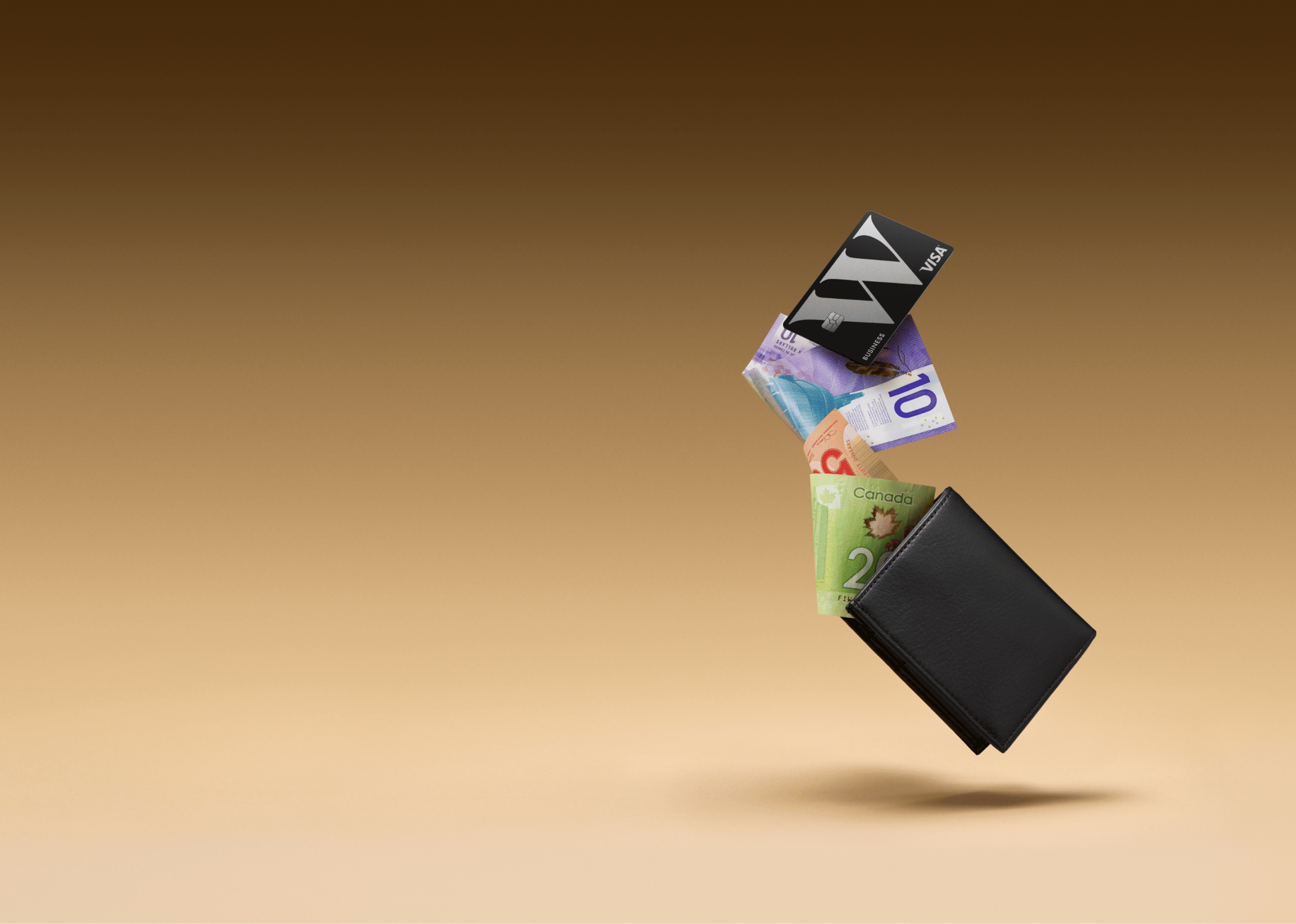A Wealthsimple Business Visa card and various bill falling out of a wallet.