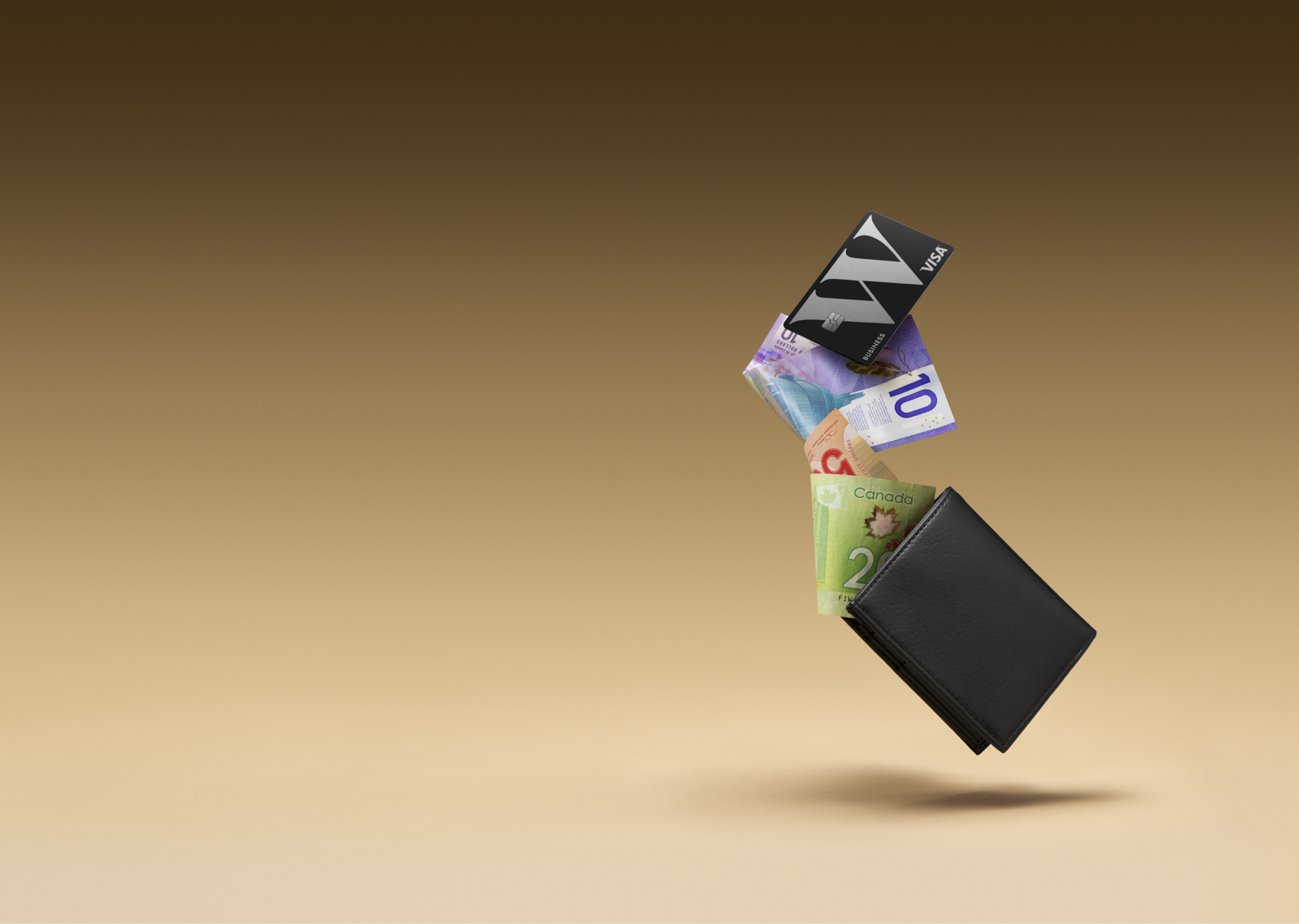 A Wealthsimple Business Visa card and various bill falling out of a wallet.