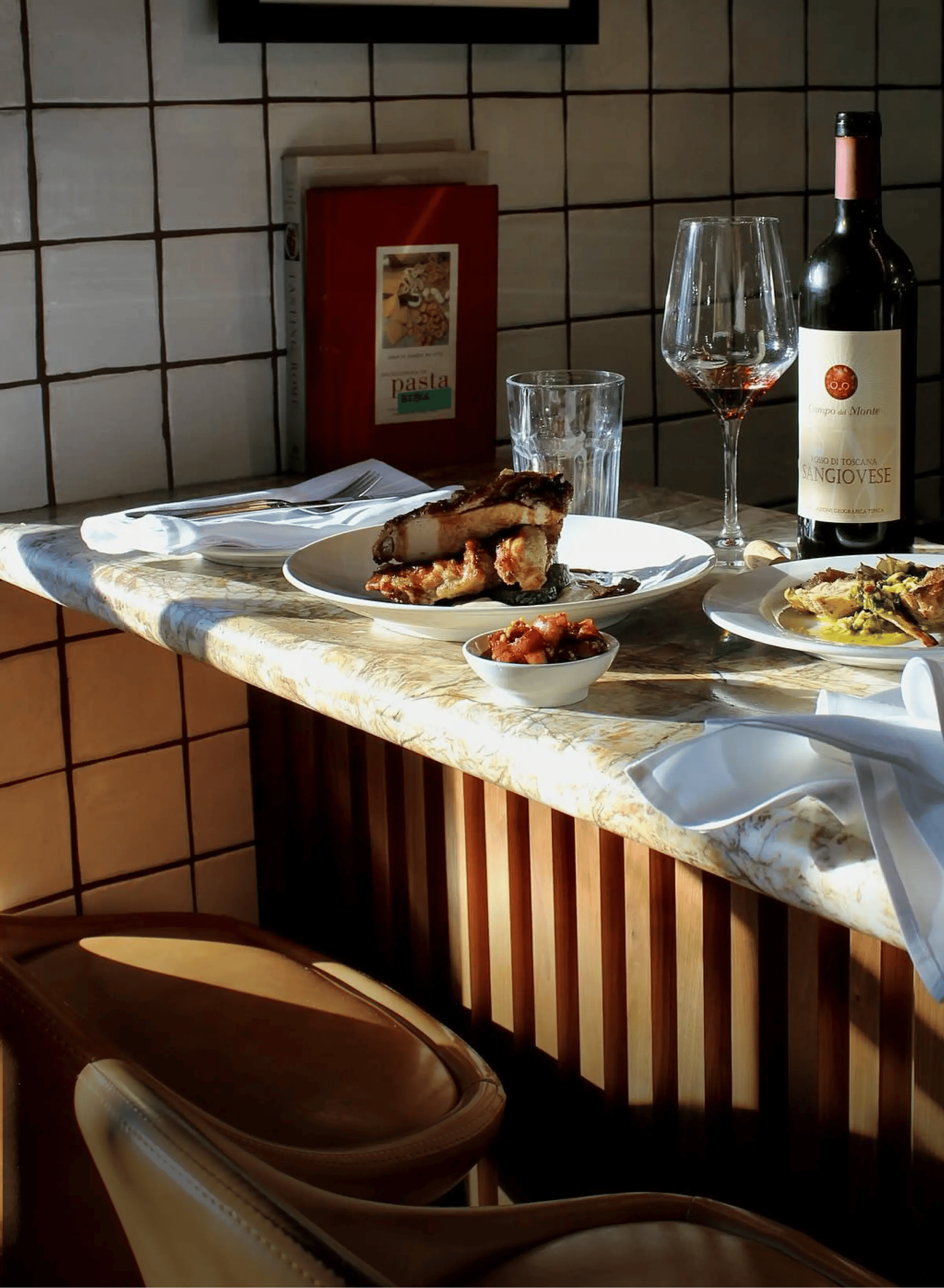 A meal with wine on a restaurant table