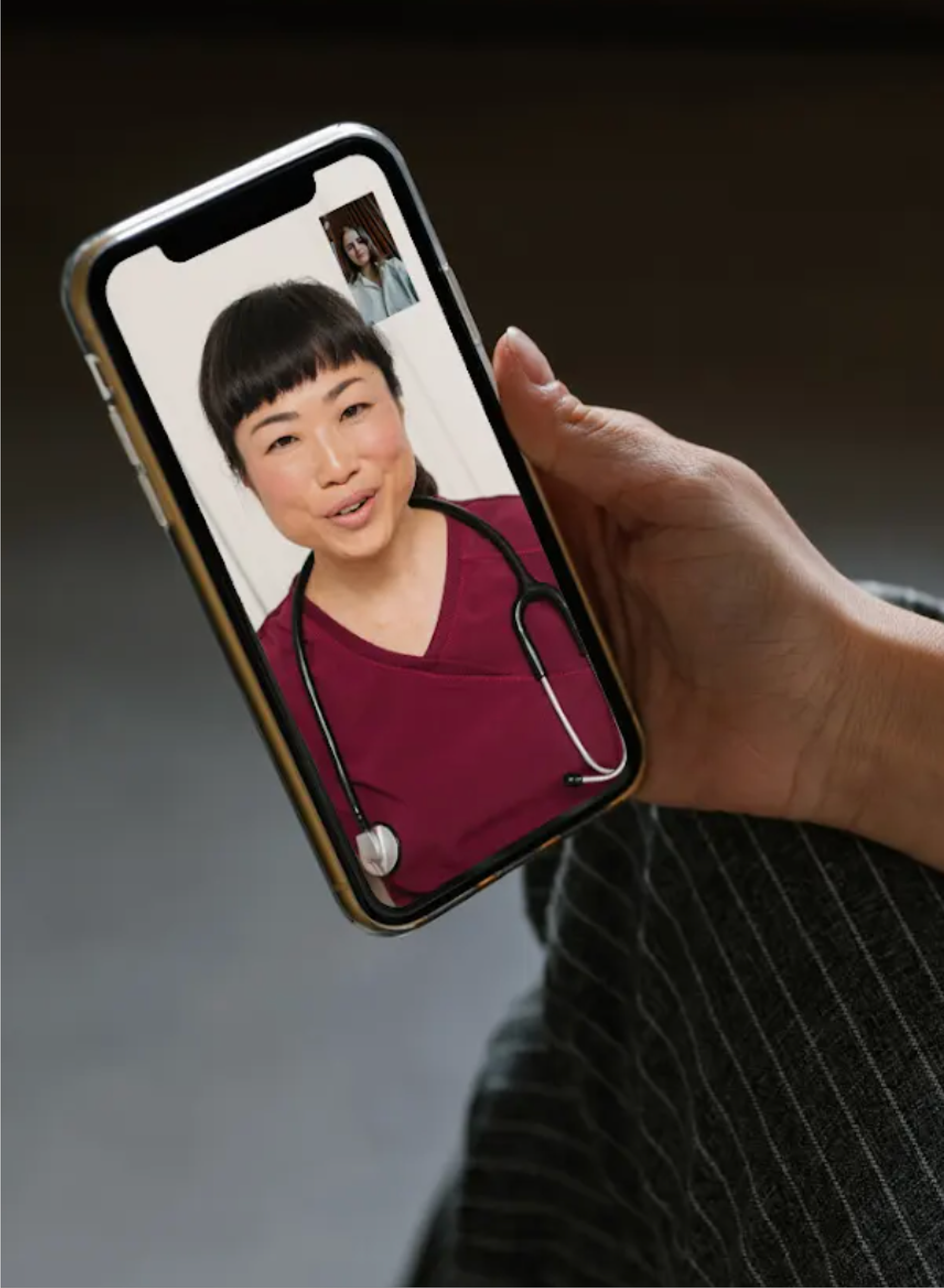 A person on a video call with a care provider on their phone