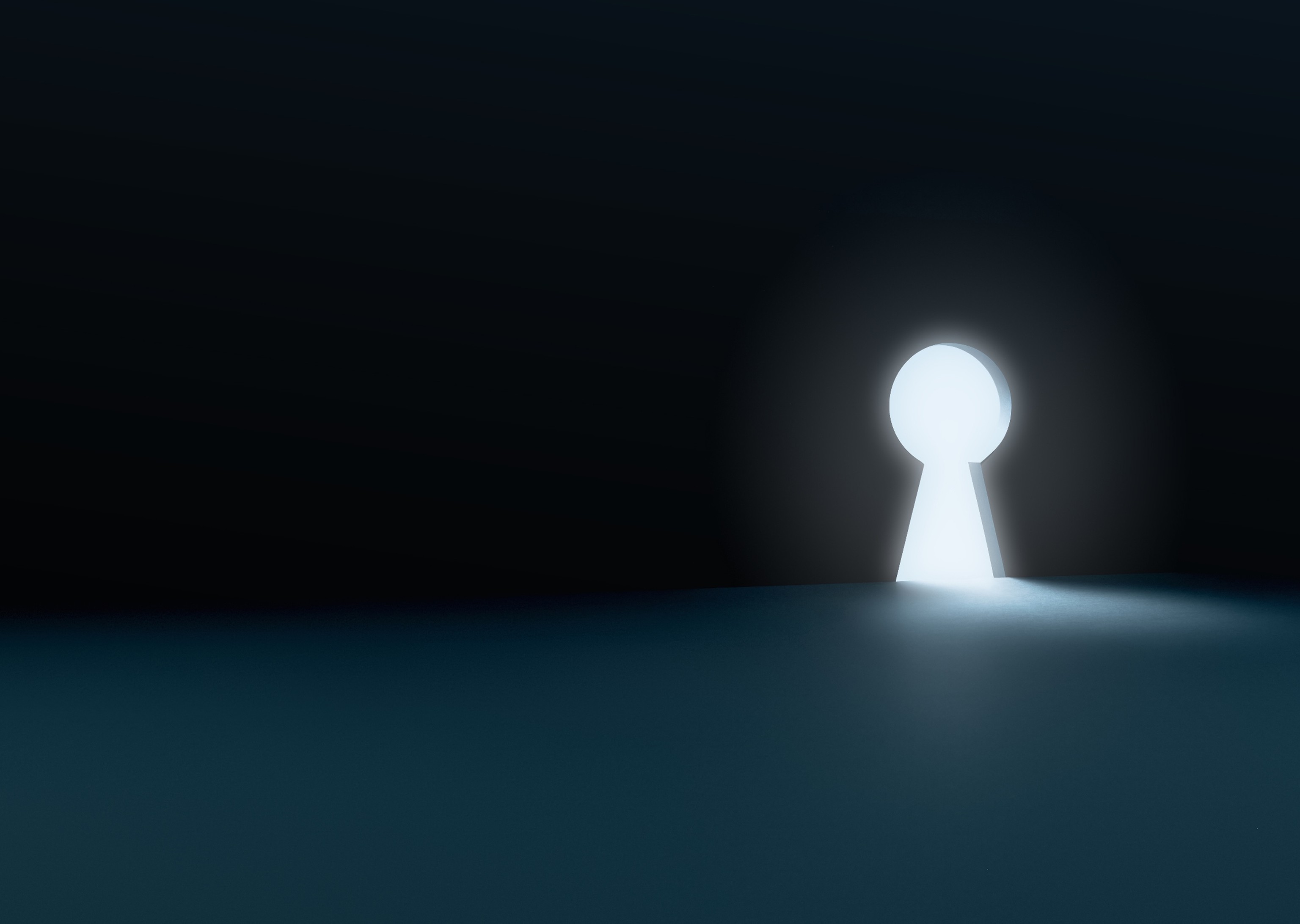 An illuminated keyhole on a dark backdrop.